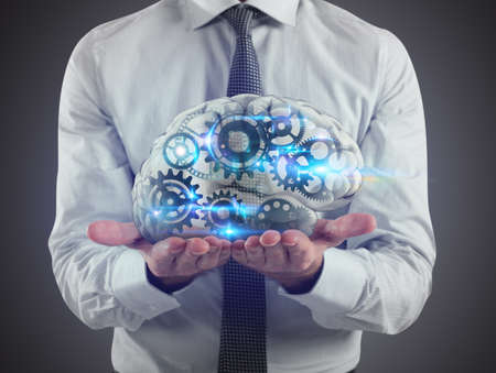 Man holds a brain with gears inside on his hands. 3D Renderingの写真素材