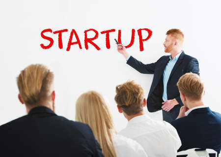 Businessman speaks about a new startup during a training meeting. Concept of successの写真素材