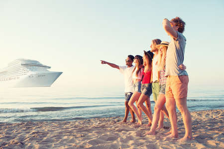 Group of happy friends having fun at ocean beach. Travel with cruiseship conceptの写真素材