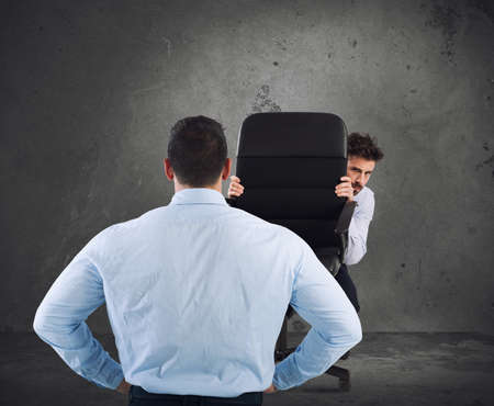 Businessman is afraid of his bossの写真素材