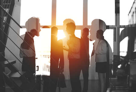 Businessmen that work together in office. Concept of teamwork and partnership. double exposure