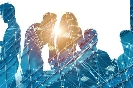Businessmen that work together in office with network effect. Concept of teamwork and partnership. double exposureの写真素材