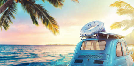 Start summertime vacation with an old car on the beach. 3D Renderingの写真素材