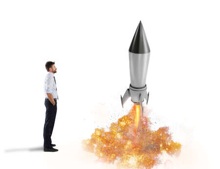 Startup of a new company with starting rocket. Concept of business growthの写真素材