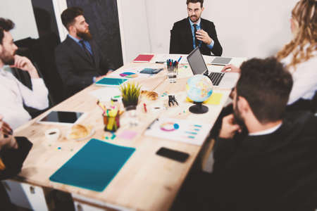 Team of businessmen work together in office. Concept of teamwork and partnershipの写真素材