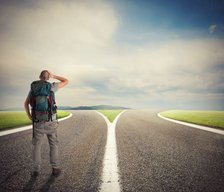 Businessman in front of a crossway must select the right wayの写真素材