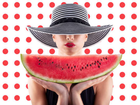 Girl in swimsuit with watermelon in hand and red circle backgroundの写真素材