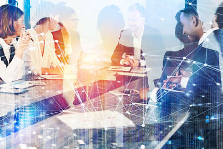 Business people work together in office with internet network effects. Concept of teamwork and...