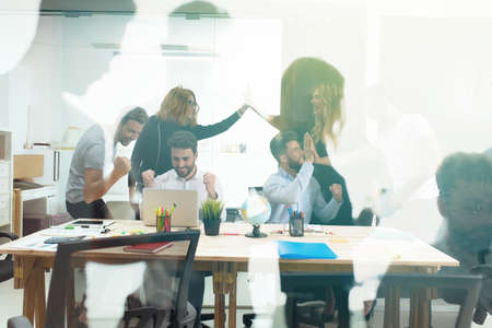 Handshaking business person in the office. concept of teamwork and business partnership. double exposureの写真素材