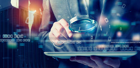 Businessman found a backdoor illegal access on a tablet. Concept of internet securityの写真素材