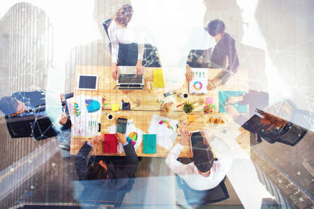 Business people work together in office. Concept of teamwork and partnership. double exposure