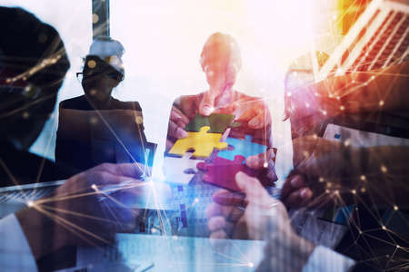 Business people work together in office. Concept of teamwork and partnership. double exposure with network effectsの写真素材