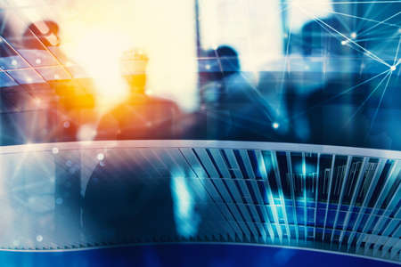 Silhouette of business people work together in office. Concept of teamwork and partnership. double exposure with network effectsの写真素材