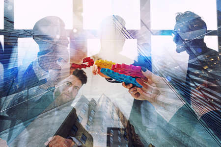 Working group of businessmen find the agreement by holding a piece of gear in hand. concept of...