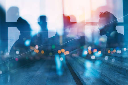 Silhouette of business people work together in office. Concept of teamwork and partnership. double exposure with network effectsの写真素材