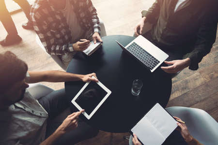 Business people work together with laptop and tablet. Concept of teamwork and startupの写真素材