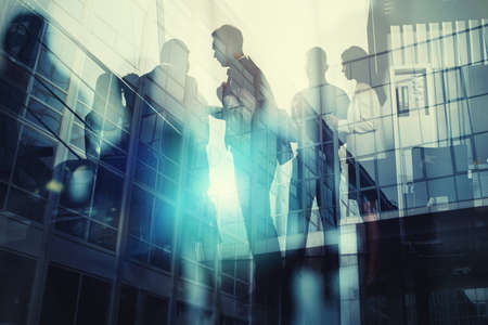 Silhouette of business people working together in office.の写真素材