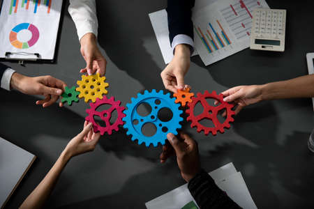 Business team connect pieces of gears.の写真素材