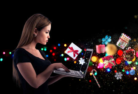 Girl orders Christmas gifts in a online shop