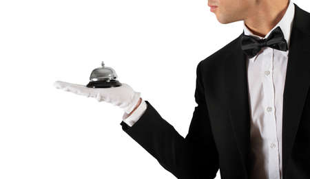 Waiter with bell in hand. Concept of first class service in your businessの写真素材