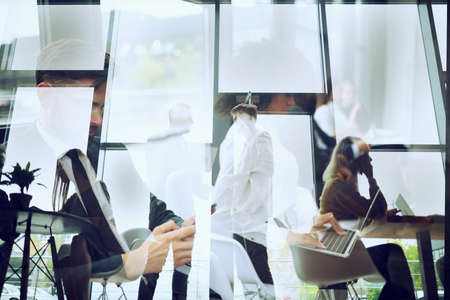 Business people collaborate together in office. Double exposure effectsの写真素材
