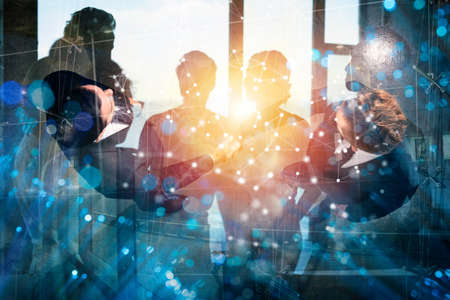 Handshaking business person in office. concept of teamwork and partnership. Double exposureの写真素材