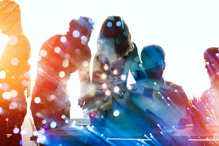 Teamwork and brainstorming concept with businessmen that share an idea with a lamp. Concept of...