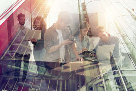 Business people collaborate together in office. Double exposure effects.の写真素材