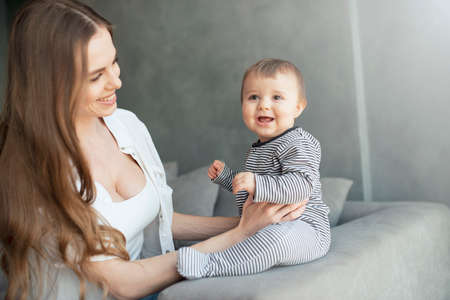 Little child smiling and happy with momの写真素材