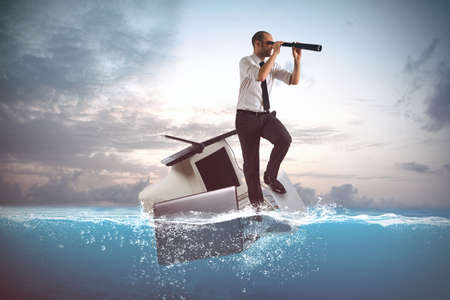 Businessman sailing on a laptops and personal computer in the sea