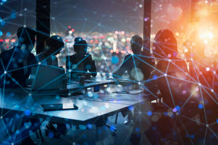 Business people work together in office at night. concept of teamwork and partnership.