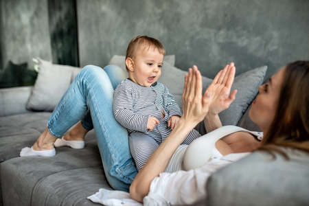 Little child smiling and happy with momの写真素材