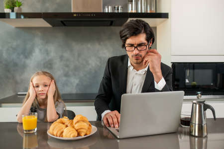 Unhappy daughter annoyed due to father workの写真素材