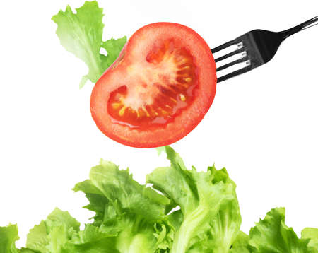 Background of mixed salad with a forkの写真素材