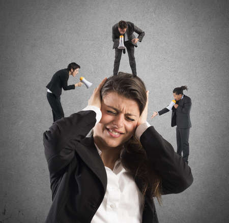 Businesswoman annoyed by screamsの写真素材
