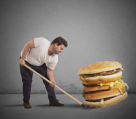 A man lift giant sandwichの写真素材