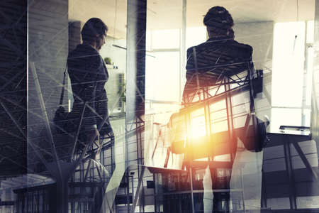 Silhouettes of businessman at the airport who waits for boarding. Double exposure.