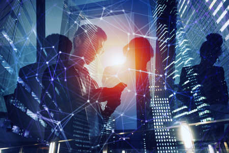 Business person in office connected on internet network. concept of startup company. Double exposureの写真素材