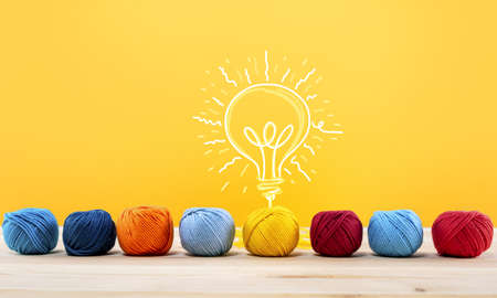 Concept of idea and innovation with wool ball that shapes a lightbulb