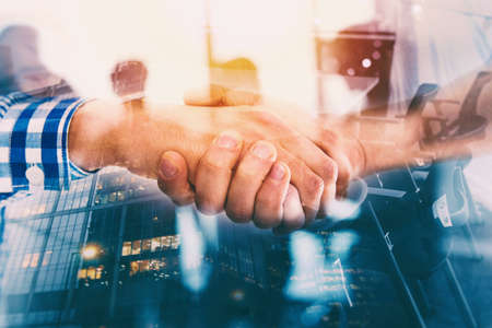 Handshaking business person in casual wear in the office. concept of teamwork and partnership....