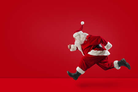 Santa Claus runs fast on red