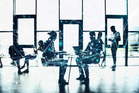 Network concept with business people silhouette working in the office.の写真素材