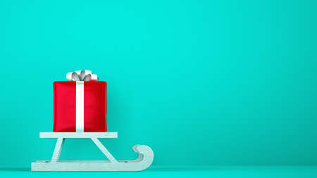 Red gift package on Christmas sleigh with cyan background