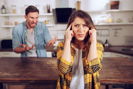 Husband and wife fight and she is tired of listening. Difficult relationship and separation conceptの写真素材
