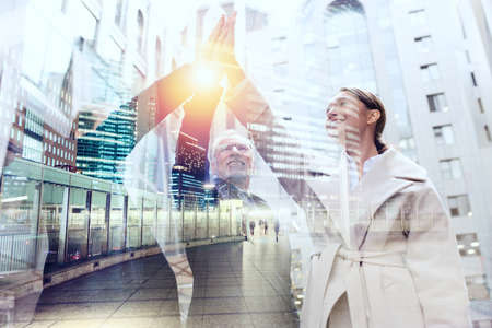 Business people putting their hands together. Concept of teamwork and partnership