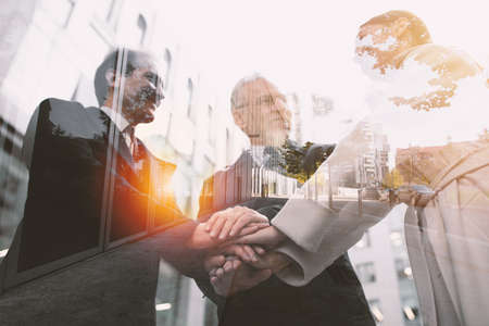 Business people putting their hands together. Concept of teamwork and partnershipの写真素材