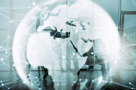 Network background concept with earth globe and people silhouette working in the office. Double exposure and network effectsの写真素材