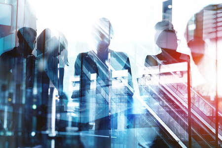 Background concept with business people silhouette at work. Double exposure and light effectsの写真素材