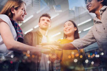Business person put their hands together. Concept of teamwork, agreement and partnership. Double...