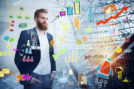 Businessman looks far for the future with a project sketch in overlay. Concept of vision and investmentの写真素材